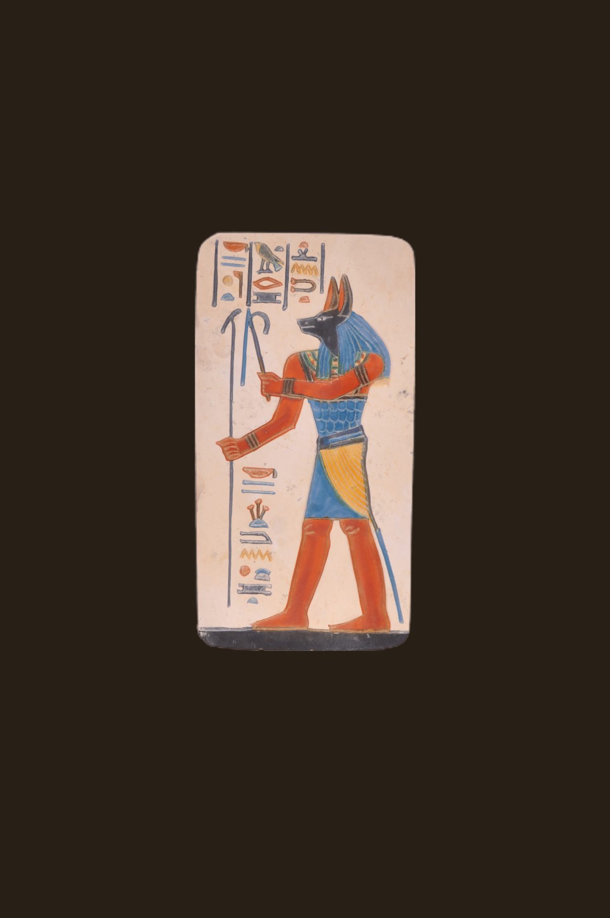 Stone plate graving representing Anubis the ancient egyptian God with heliographic letters